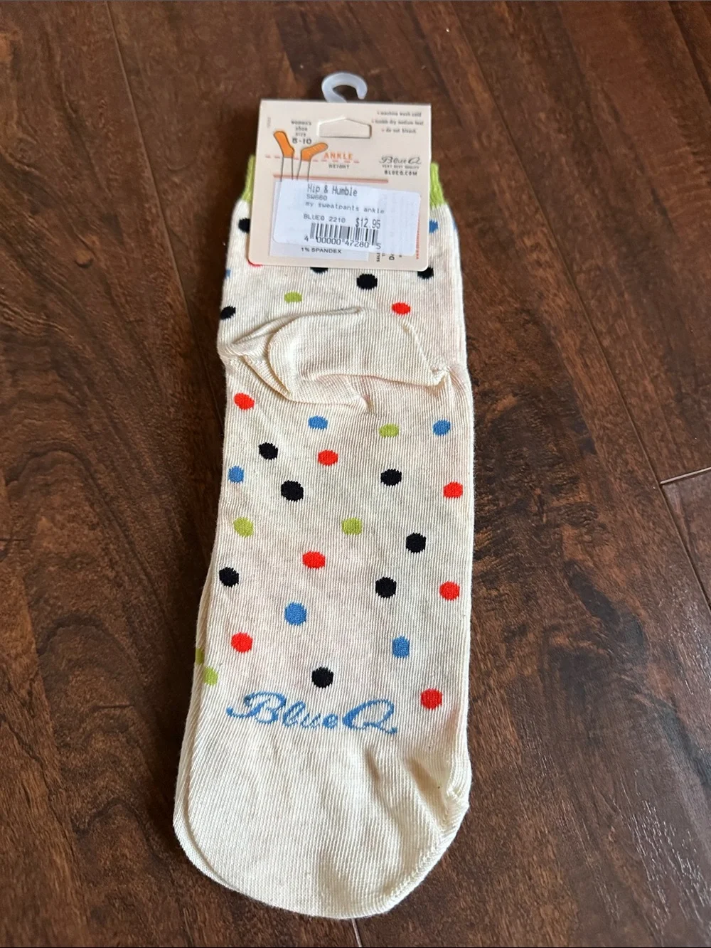 Blue Q Cream Crew Socks with Red Text and Blue & Green Graphic